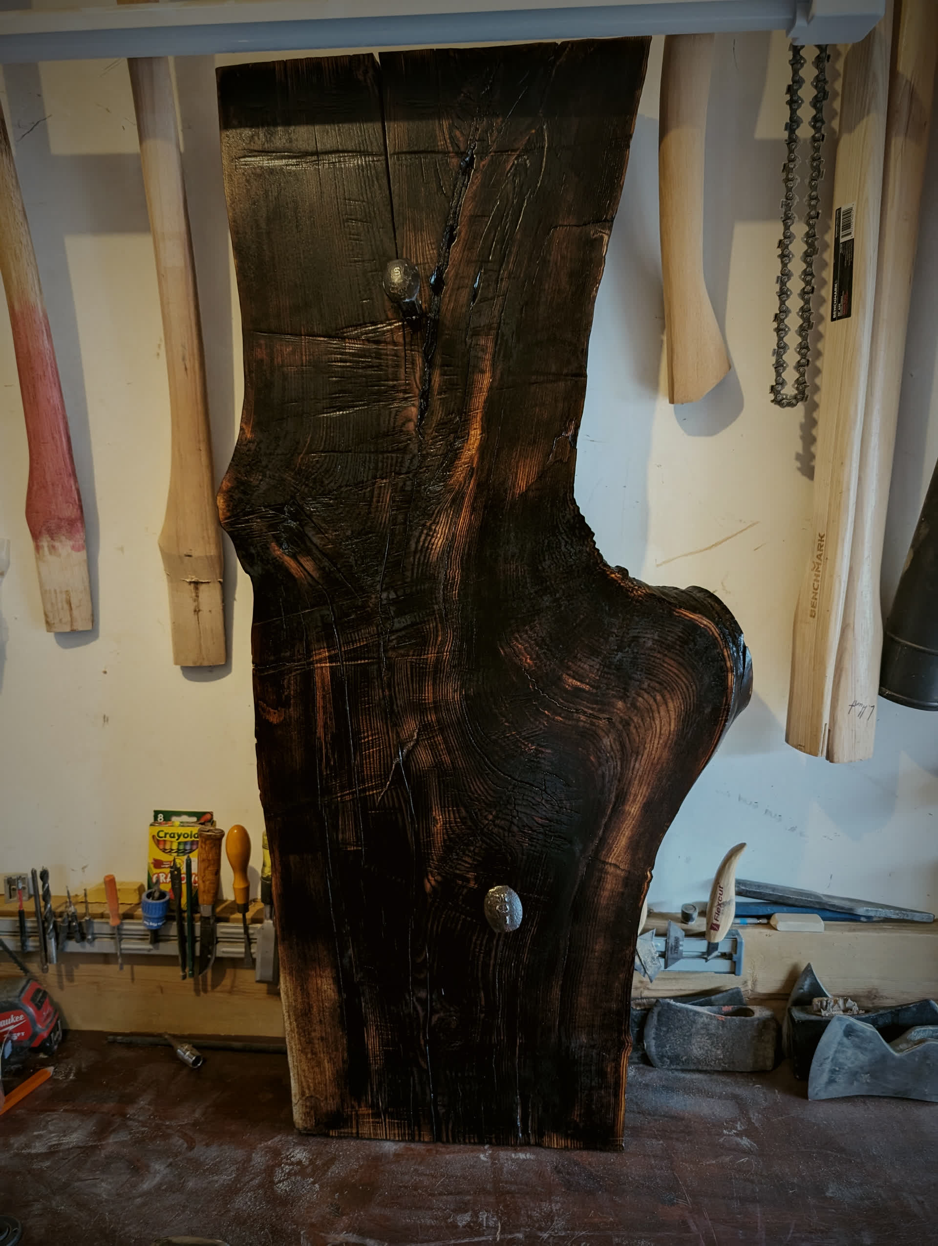 Hand-carved axe on a charred live-edge slab, made in the Hawthorn shop