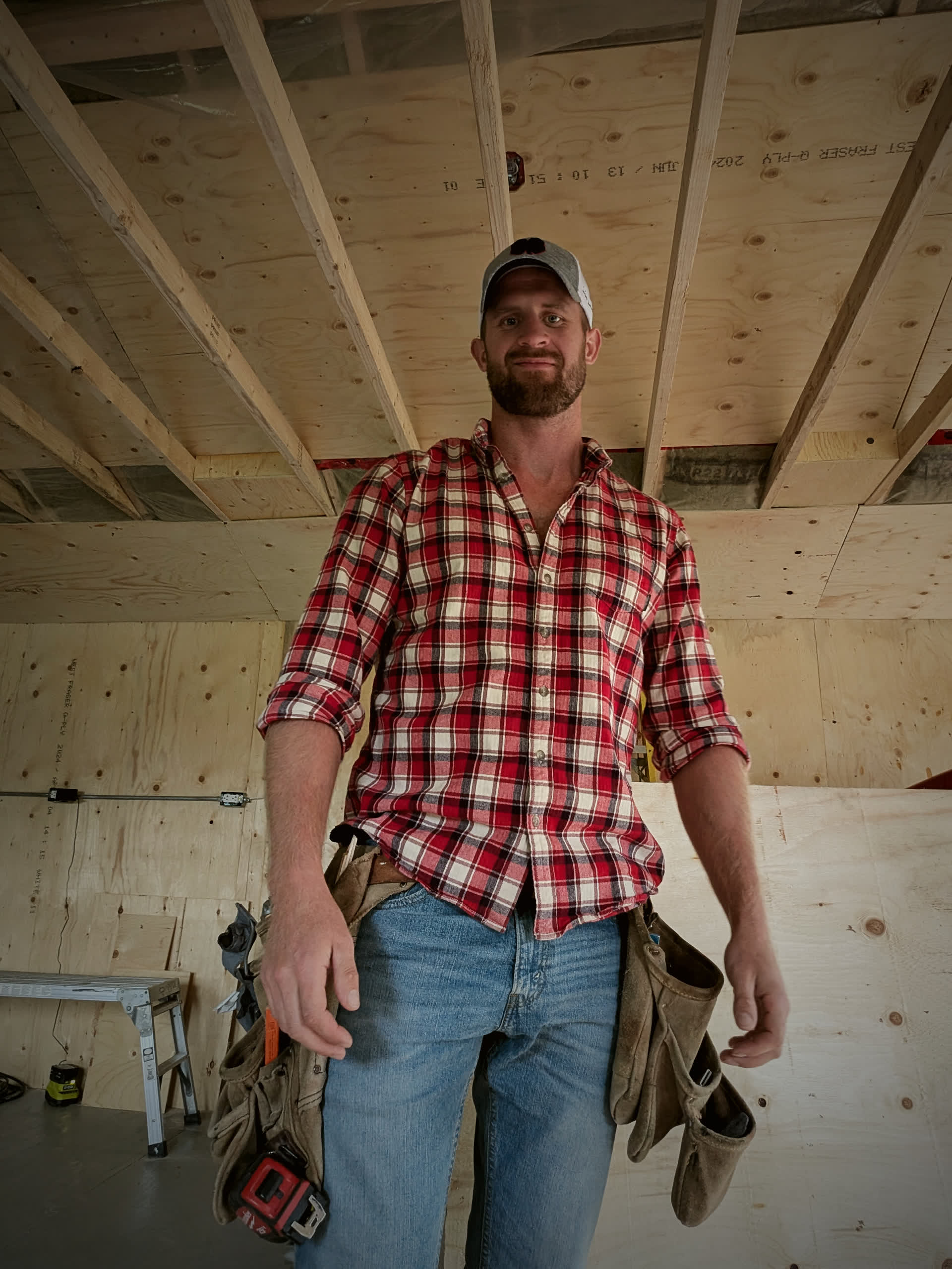 Cameron Heaphy, owner of Hawthorn Construction, on site with his tool belt